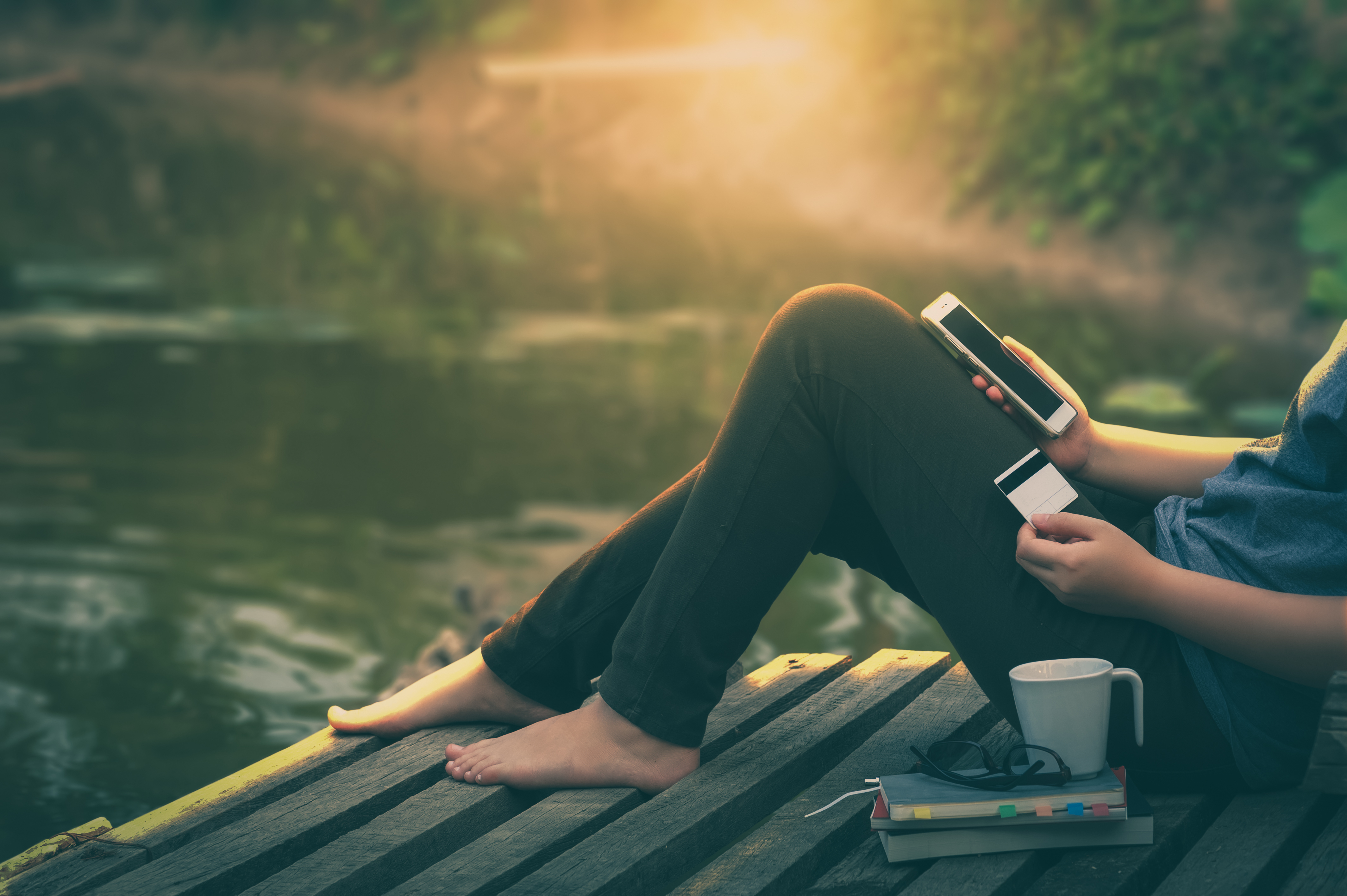 Woman banking through her mobile phone