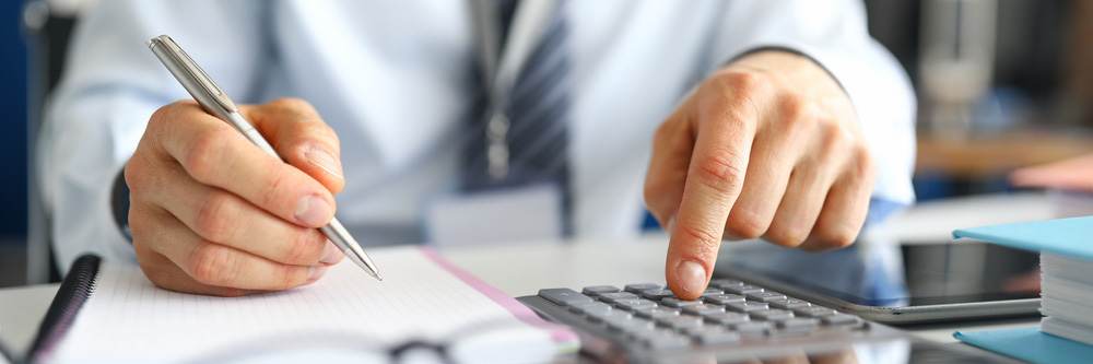 Man using calculator